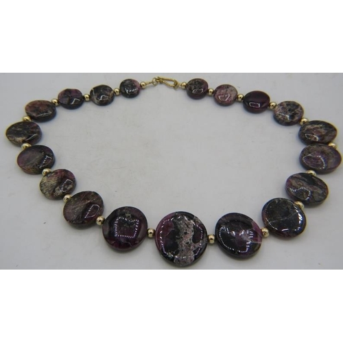 338 - An unusual graduated tourmaline necklace consisting of 19 flat round tourmaline discs interspersed w... 