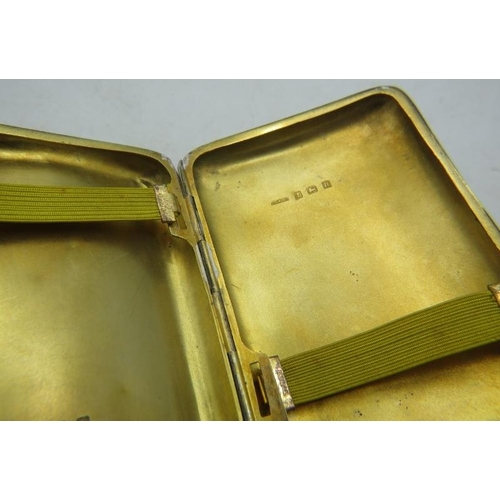 348 - A silver cigarette case with Fleur De Lis design and gilded interior. Birmingham 1907. 2 troy oz/63 ... 