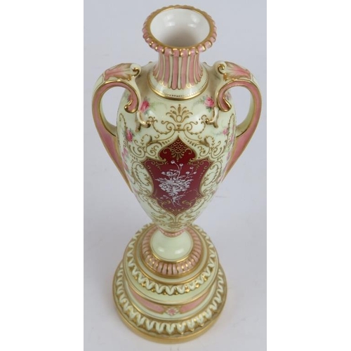 37 - An Edwardian Royal Worcester Pate-sur-pate urn vase with gilt and pink decoration over an ivory grou... 