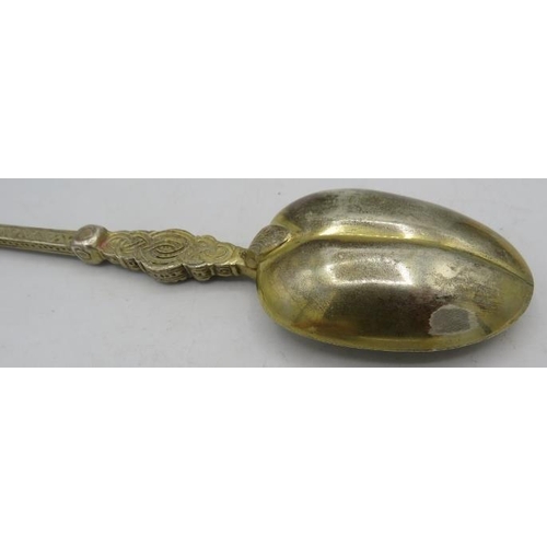 385 - A large engraved white metal anointing spoon.
Condition report: Some wear.