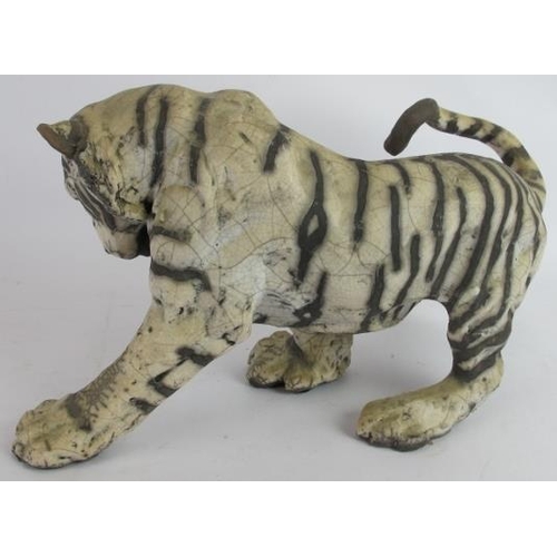 4 - A glazed pottery figure of a tiger cub by Keza Rudge, signed. Length 41cm. Height 23cm.
Condition re... 