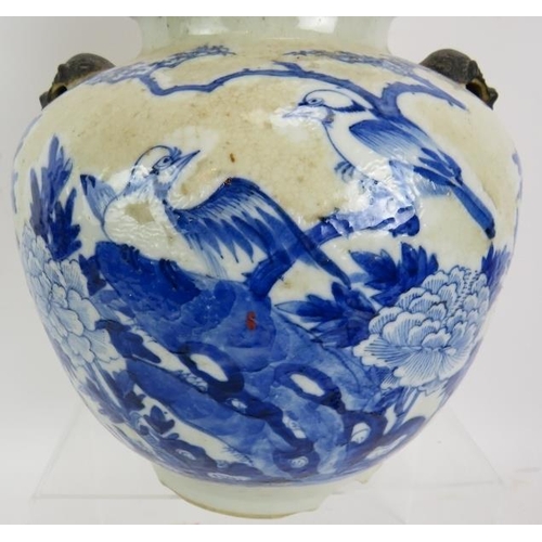 42 - A 19th century Chinese blue and white crackle ware porcelain vase and cover in the Kangxi style pain... 