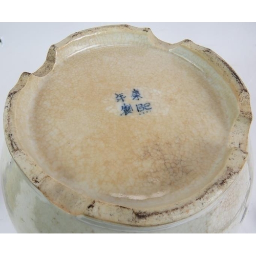 42 - A 19th century Chinese blue and white crackle ware porcelain vase and cover in the Kangxi style pain... 