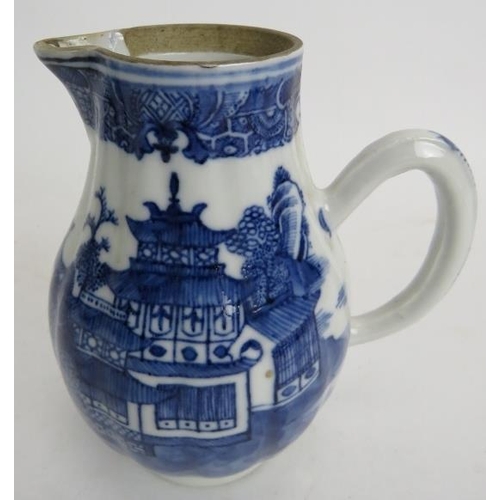 43 - An 18th century Chinese blue and white porcelain teapot and cover, decorated with a continual river ... 