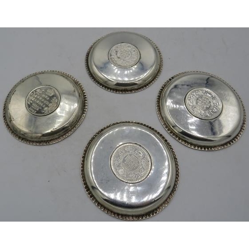 441 - A set of 4 small circular silver dishes inset with one Rupee coins. 1907, 1917 and 1919. Edward VII ... 