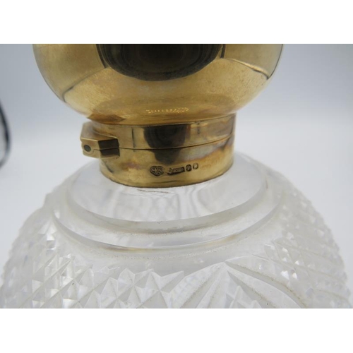 477 - A large circular cut glass scent bottle with 9ct gold hinged top and inner stopper engraved with 'Ja... 