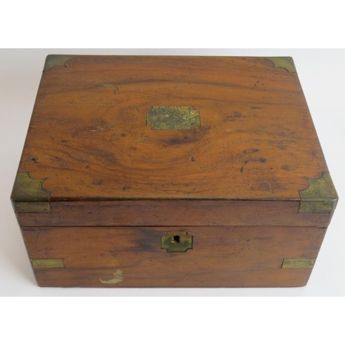 48 - A 19th century walnut writing slope with brass mounts and fitted interior. 29.5cm x 23.5cm x 15cm. 
... 