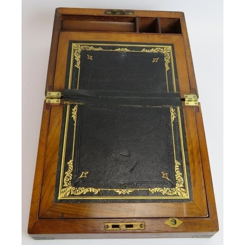 48 - A 19th century walnut writing slope with brass mounts and fitted interior. 29.5cm x 23.5cm x 15cm. 
... 