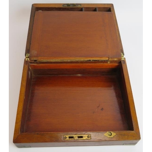 48 - A 19th century walnut writing slope with brass mounts and fitted interior. 29.5cm x 23.5cm x 15cm. 
... 