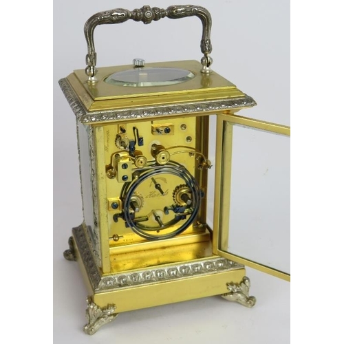 54 - An ornate gilt and silver plated brass Repeater carriage clock with strike and alarm movement, keys ... 