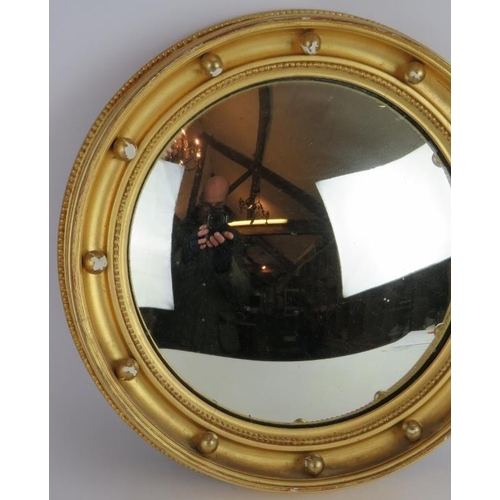 56 - A circular gilt framed convex mirror with bead decoration, diameter: 40cm.
Condition report: Some gi... 