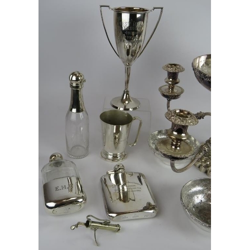 58 - A mixed lot of silver plate including a candelabra, fruit set, hip flasks, trophies, sauce bottle, c... 