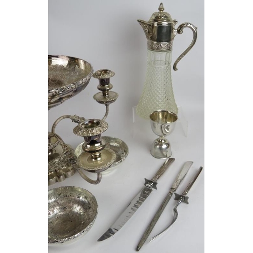 58 - A mixed lot of silver plate including a candelabra, fruit set, hip flasks, trophies, sauce bottle, c... 