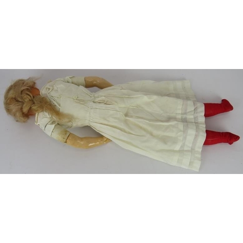 62 - An antique wax headed doll with hand painted features. Straw filled body and plaster limbs. Overall ... 