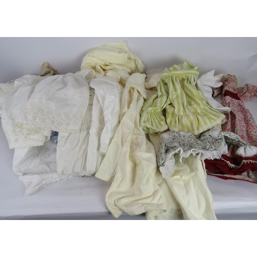 70 - A large quantity of mainly period dolls clothing including dressers and underwear, some silk. (50+).... 