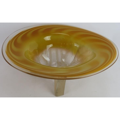 79 - A large blown glass bowl by Neal Drobnis (American). Swirled amber bowl on tripod sand finished legs... 