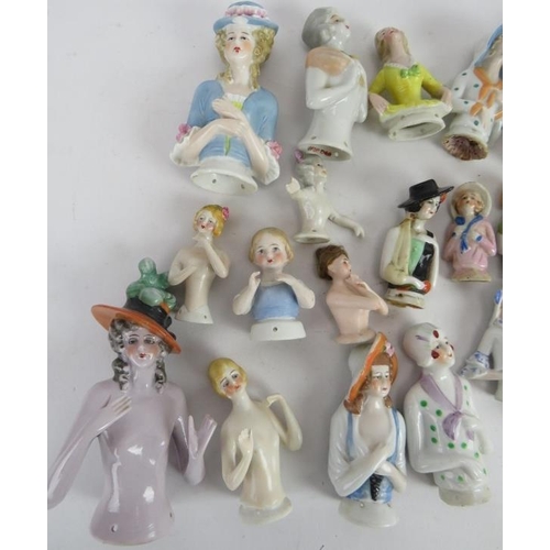 97 - A collection of porcelain doll brush tops of varying design, mostly continental. (QTY).
Condition re... 