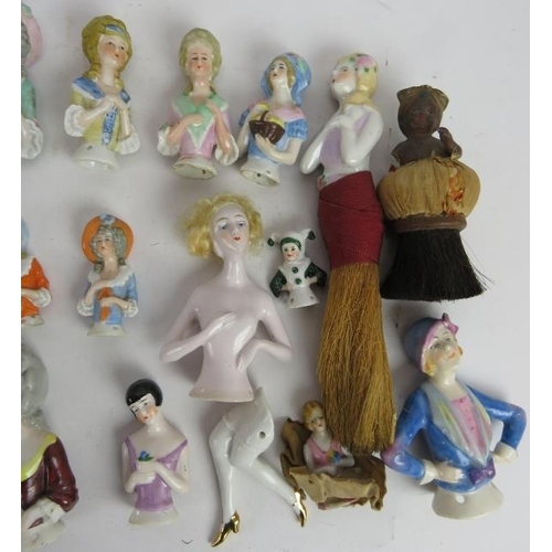 97 - A collection of porcelain doll brush tops of varying design, mostly continental. (QTY).
Condition re... 