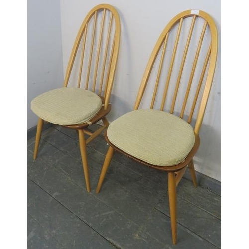 703 - A pair of mid-century elm and beech blond Ercol Windsor Quaker dining chairs, on turned canted suppo... 