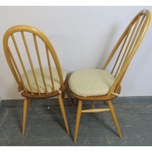 703 - A pair of mid-century elm and beech blond Ercol Windsor Quaker dining chairs, on turned canted suppo... 