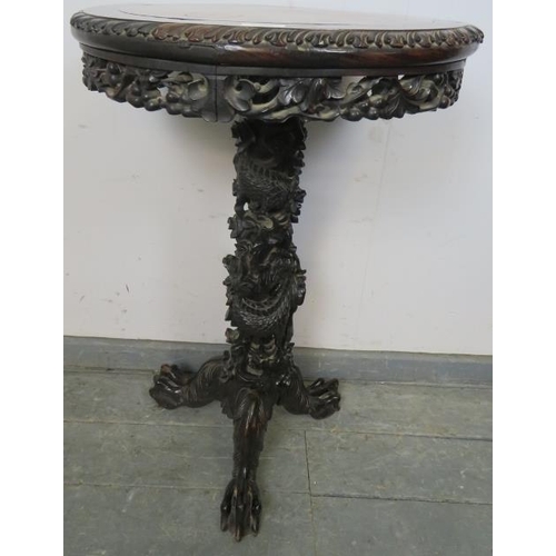 707 - A 19th century Chinese rosewood circular occasional table, with inset red marble top above a foliate... 