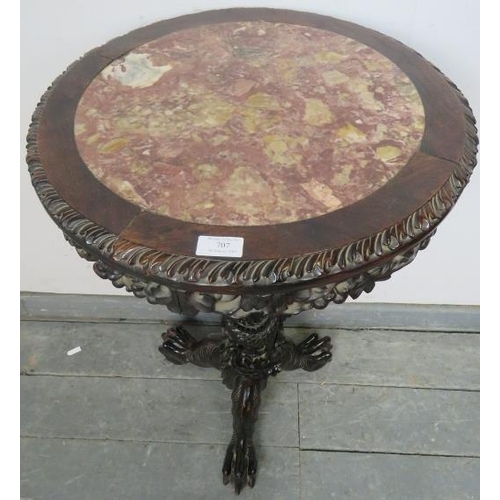 707 - A 19th century Chinese rosewood circular occasional table, with inset red marble top above a foliate... 