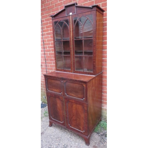 709 - A fine Regency Period tall library secretaire bookcase, the astral glazed doors opening onto two hei... 