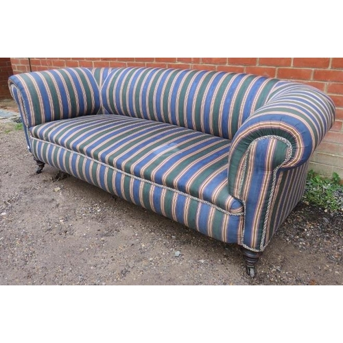 712 - A Victorian Chesterfield sofa, reupholstered in a contemporary striped material with braided rope tr... 