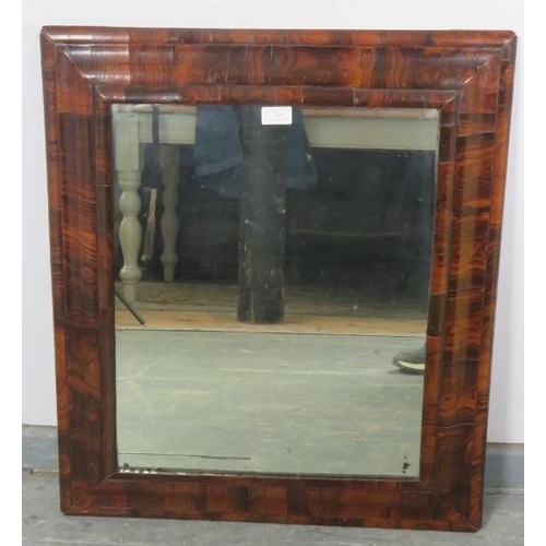 716 - A 17th century William & Mary Period walnut oyster veneer cushion frame wall mirror, retaining the o... 