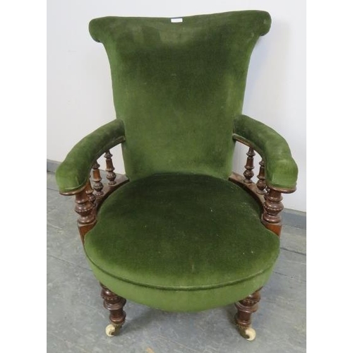 725 - A Victorian mahogany scroll back open-sided armchair, with turned and beaded spindles, upholstered i... 