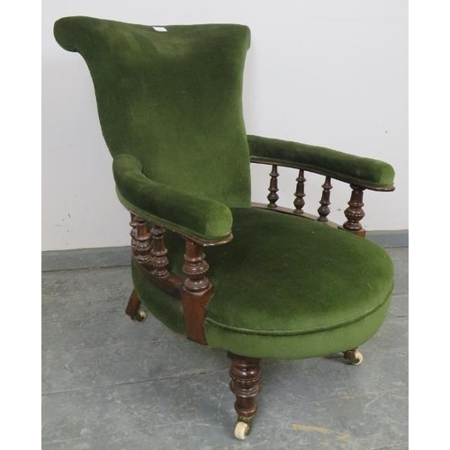 725 - A Victorian mahogany scroll back open-sided armchair, with turned and beaded spindles, upholstered i... 