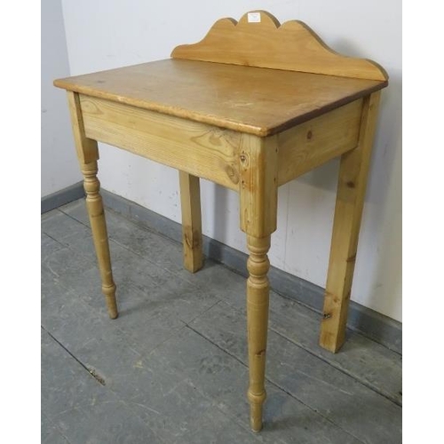 727 - An antique stripped pine washstand with shaped gallery, on tapering front supports and square rear s... 