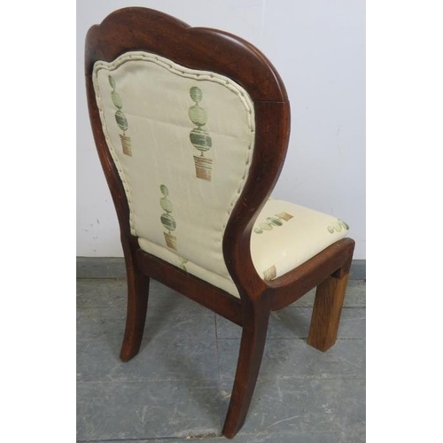 731 - A small Victorian walnut spoon-back chair, reupholstered in a contemporary buttoned material, on squ... 