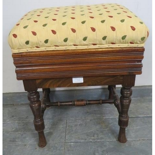 732 - An Edwardian mahogany height adjustable music stool, re-upholstered in a gold patterned material, on... 