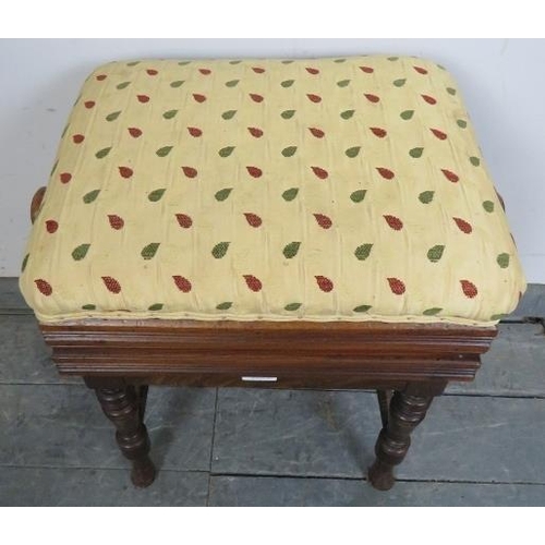 732 - An Edwardian mahogany height adjustable music stool, re-upholstered in a gold patterned material, on... 