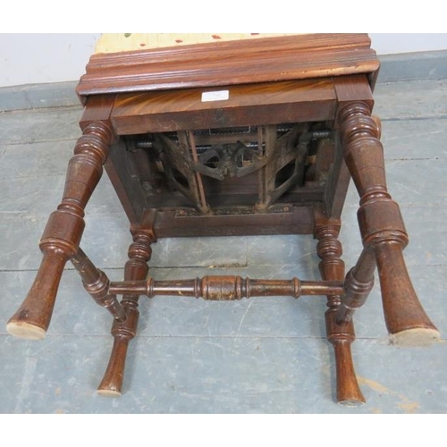 732 - An Edwardian mahogany height adjustable music stool, re-upholstered in a gold patterned material, on... 