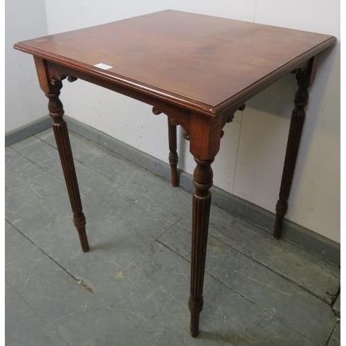 743 - An Edwardian Regency Revival mahogany and oak square lamp table, on tapering fluted supports. 
Condi... 