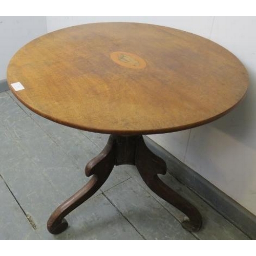 748 - A Georgian walnut circular wine table with shell inlay, on a baluster turned column with scrolled tr... 