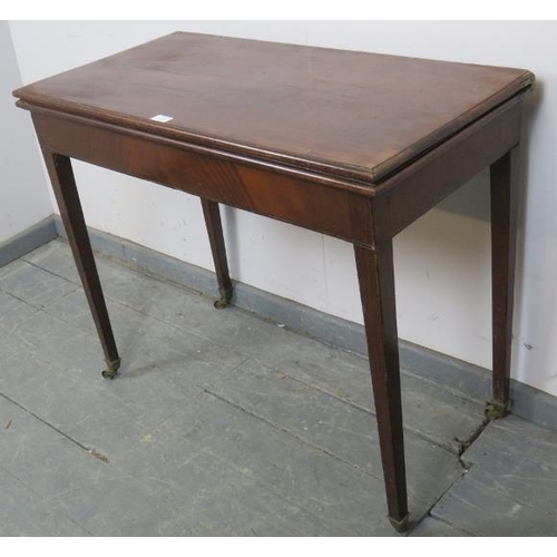 752 - A Georgian mahogany turnover card table, crossbanded and strung with satinwood, on tapering square s... 