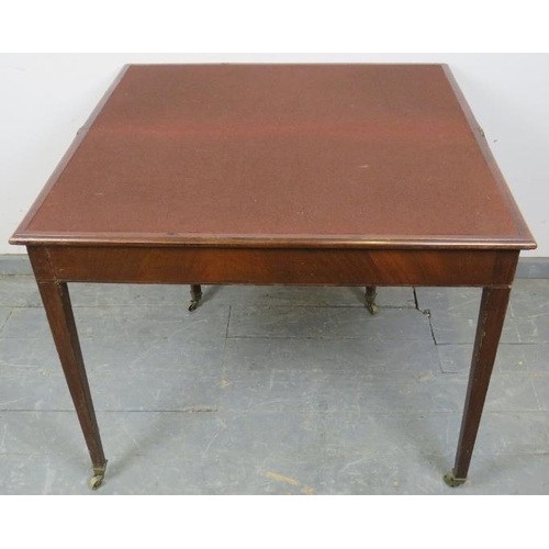 752 - A Georgian mahogany turnover card table, crossbanded and strung with satinwood, on tapering square s... 