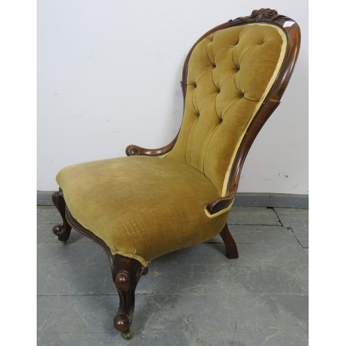 761 - A Victorian walnut spoon-back nursing chair, upholstered in buttoned caramel velvet material with go... 