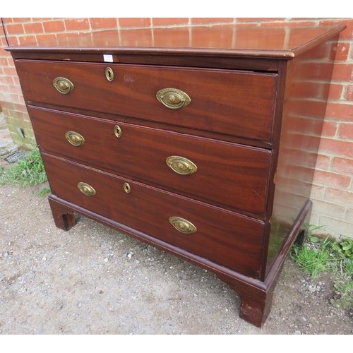 765 - A George III mahogany straight front chest of three long graduated oak-lined drawers with pressed gi... 