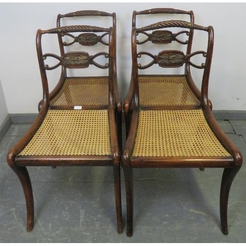 774 - Four Regency Period rosewood rope back dining chairs with brass mounts, featuring cast brass eagle m... 