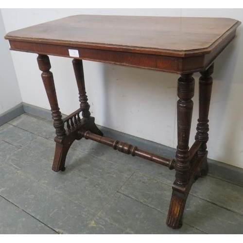 783 - A late Victorian walnut stretcher table, with turned supports and spindles to either end, on reeded ... 