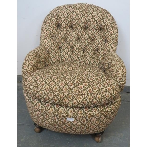 792 - A Victorian tub chair, upholstered in buttoned tapestry material, on tapering supports with castors.... 