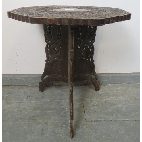 793 - An early 20th century Anglo Indian hardwood octagonal occasional table, with brass inlay and relief ... 