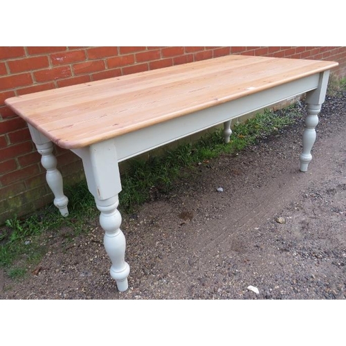 795 - A vintage stripped pine kitchen table, on baluster supports painted distressed white. 
Condition rep... 