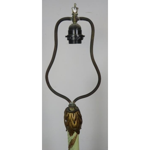 810 - An ornate metal standard lamp in the Florentine taste, with painted rope twist column and gilt acant... 