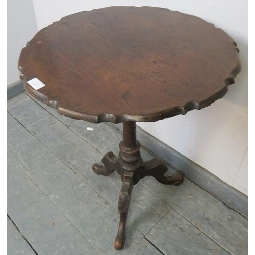 812 - A Georgian and later mahogany piecrust occasional table, on a turned column with scrolled tripod sup... 