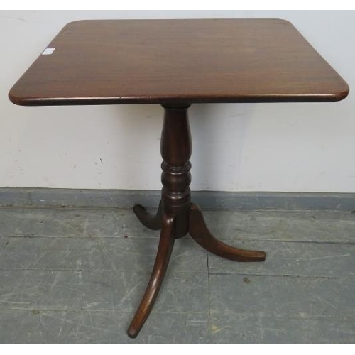 845 - A Victorian mahogany rectangular tilt-top wine table, on a baluster turned column with splayed tripo... 